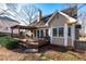 Back exterior featuring a deck and lush green backyard at 2385 Cape Courage Way, Suwanee, GA 30024