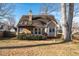 Back exterior featuring a covered porch with an inviting backyard at 2385 Cape Courage Way, Suwanee, GA 30024