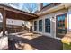 Inviting back porch with outdoor seating, swing and table at 2385 Cape Courage Way, Suwanee, GA 30024