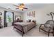 Bedroom with a large bed, dresser, and chair, offering a relaxing atmosphere at 2385 Cape Courage Way, Suwanee, GA 30024