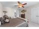 Bedroom with a large bed, dresser, and chair, offering a relaxing atmosphere at 2385 Cape Courage Way, Suwanee, GA 30024