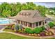 Clubhouse with a large covered porch and manicured landscaping at 2385 Cape Courage Way, Suwanee, GA 30024