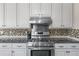 This kitchen boasts stainless steel appliances, granite countertops, and ample cabinet space at 2385 Cape Courage Way, Suwanee, GA 30024