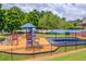 Community playground with slides, swings, and climbing structures at 2385 Cape Courage Way, Suwanee, GA 30024