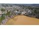 Aerial view of the community, including lake and surrounding neighborhood at 325 Morning Mist Walk, Suwanee, GA 30024