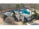 Aerial view of community clubhouse and pool at 325 Morning Mist Walk, Suwanee, GA 30024
