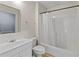 Bathroom featuring a sink, mirror, and shower with curtain at 325 Morning Mist Walk, Suwanee, GA 30024