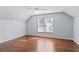 Bedroom featuring a high ceiling and hardwood floors at 325 Morning Mist Walk, Suwanee, GA 30024