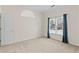 Well-lit bedroom with a double window and neutral carpet at 325 Morning Mist Walk, Suwanee, GA 30024