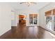 Bright dining area features hardwood floors, modern lighting, and windows with lovely views to the outside at 325 Morning Mist Walk, Suwanee, GA 30024