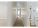 Hallway connecting bedrooms with bathroom at 325 Morning Mist Walk, Suwanee, GA 30024