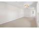 Spacious room featuring neutral carpet, bright light, and an electrical panel at 325 Morning Mist Walk, Suwanee, GA 30024