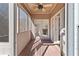 Cozy covered patio with wood deck flooring and views of the surrounding nature, a great place to unwind at 325 Morning Mist Walk, Suwanee, GA 30024