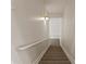 Carpeted stairway with handrail at 325 Morning Mist Walk, Suwanee, GA 30024