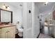 Well-lit half bathroom with a stylish vanity and classic fixtures, conveniently located in the hallway at 4160 Westchester Ne Xing, Roswell, GA 30075