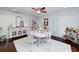 Inviting dining room with a bright aesthetic, white table, and hardwood floors at 4160 Westchester Ne Xing, Roswell, GA 30075