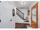 Elegant foyer with hardwood floors, showcasing a staircase and a decorative front door at 4160 Westchester Ne Xing, Roswell, GA 30075