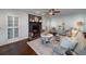 Cozy living room featuring a brick fireplace, hardwood floors, and elegant decor at 4160 Westchester Ne Xing, Roswell, GA 30075