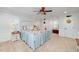 Comfortable main bedroom featuring a ceiling fan, lots of windows, and neutral carpet at 4160 Westchester Ne Xing, Roswell, GA 30075