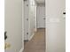 Hallway features neutral walls, white doors, and tile floors at 5454 Glen Haven Dr, Atlanta, GA 30349