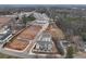 Aerial view of townhome construction site, showing roads, green space, and residential units at 1915 Cassia Aly, Kennesaw, GA 30144