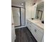 Bright bathroom with dual sinks, modern fixtures, and a glass-enclosed shower at 1915 Cassia Aly, Kennesaw, GA 30144
