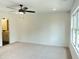 Spacious bedroom with a ceiling fan, neutral carpet, and great natural light at 1915 Cassia Aly, Kennesaw, GA 30144