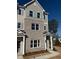 Exterior view of modern brick townhomes, with covered entrances and gray accents at 1915 Cassia Aly, Kennesaw, GA 30144