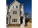 Charming townhome featuring brick facade, gray siding, and well-manicured landscaping at 1915 Cassia Aly, Kennesaw, GA 30144