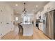 Modern kitchen with white cabinets, stainless steel appliances, and a large center island at 1915 Cassia Aly, Kennesaw, GA 30144