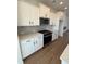 Modern kitchen features white cabinets, stainless steel appliances, and hardwood floors at 1915 Cassia Aly, Kennesaw, GA 30144
