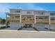 Townhome rear exterior featuring decks and garages at 1915 Cassia Aly, Kennesaw, GA 30144