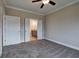 Cozy carpeted bedroom with neutral walls and access to an ensuite bathroom at 201 Daisy Coourt, Cartersville, GA 30121