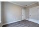 Carpeted bedroom with two doors at 201 Daisy Coourt, Cartersville, GA 30121