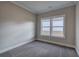 Bedroom with neutral walls, carpeting and a bright window at 201 Daisy Coourt, Cartersville, GA 30121