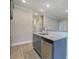 A close up of the kitchen island featuring a stainless steel dishwasher, faucet and granite countertops at 201 Daisy Coourt, Cartersville, GA 30121