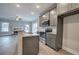 Modern kitchen with gray cabinets, stainless steel appliances, and granite countertops at 201 Daisy Coourt, Cartersville, GA 30121