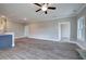 Open-concept living room and kitchen area with wood-look floors and neutral paint at 201 Daisy Ct, Cartersville, GA 30121