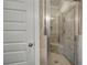 Tiled walk-in shower with corner bench seating at 201 Daisy Coourt, Cartersville, GA 30121