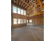 Unfinished new construction interior view with a soaring ceiling and many windows at 2160 Suncrest Point, Marietta, GA 30064