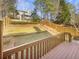 Expansive backyard featuring a wooden deck and terraced landscaping, great for outdoor enjoyment at 4405 Thorngate Ln, Acworth, GA 30101