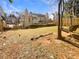 Large backyard with mature trees, a swing, and plenty of space for outdoor activities at 4405 Thorngate Ln, Acworth, GA 30101