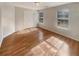 Cozy bedroom with hardwood floors and natural light from dual windows at 4405 Thorngate Ln, Acworth, GA 30101