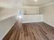 Bright loft area featuring hardwood floors and access to attic space at 4405 Thorngate Ln, Acworth, GA 30101