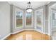 Cozy breakfast nook with hardwood floors, light gray walls, and a pendant light fixture at 1168 Christiana Xing, Lawrenceville, GA 30043