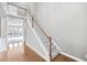 Bright foyer featuring hardwood floors, high ceilings, and a staircase with white railings at 1168 Christiana Xing, Lawrenceville, GA 30043