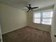 Cozy bedroom with a ceiling fan and large window offering plenty of natural light at 1711 Nappa Valley Se Ct, Smyrna, GA 30080