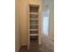 Walk-in closet with shelving providing ample storage space for clothes and accessories at 1711 Nappa Valley Se Ct, Smyrna, GA 30080