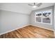 This bedroom features hardwood floors, recessed lighting, and large double windows at 3185 Tackett Rd, Douglasville, GA 30135