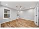 This bedroom features hardwood floors, recessed lighting, a ceiling fan, and two windows at 3185 Tackett Rd, Douglasville, GA 30135